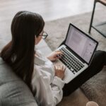 Woman Working At Home Using Her Laptop